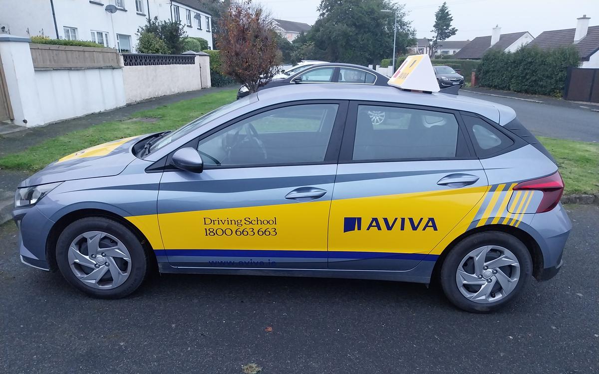 Philip's Aviva driving school car, a grey Hyundai with yellow livery and a learner roof sign